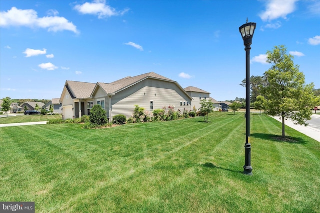 view of side of home with a lawn