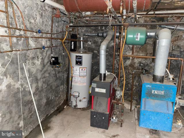 utility room with water heater