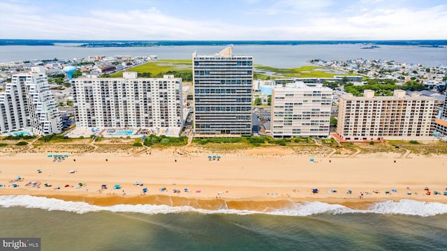 bird's eye view with a water view and a view of the beach