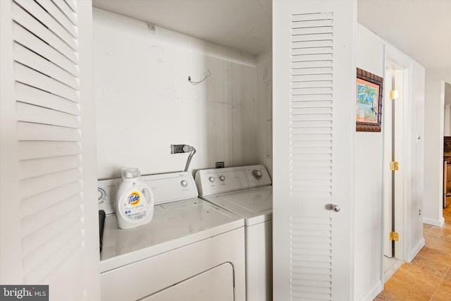 laundry area with washing machine and dryer