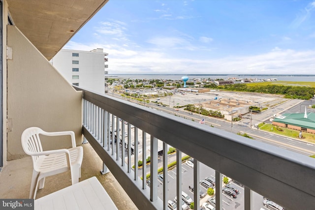 balcony featuring a water view