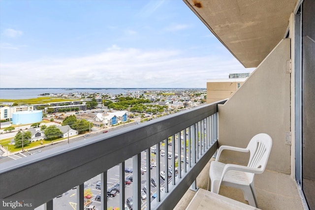 balcony featuring a water view