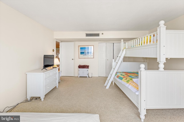 carpeted bedroom with a closet