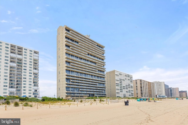 view of property with a view of the beach