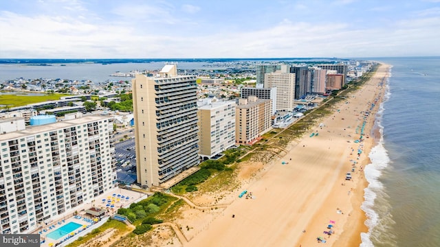 aerial view featuring a view of the beach and a water view