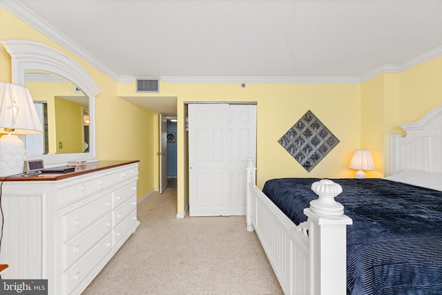 bedroom featuring light colored carpet, crown molding, and a closet