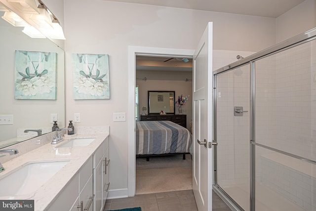 bathroom featuring walk in shower, tile patterned floors, and vanity