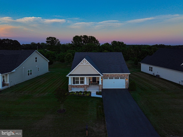 view of front of house with a garage and covered porch