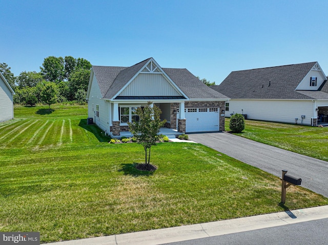 view of front of home featuring a garage and a front yard