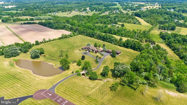 drone / aerial view with a rural view and a water view