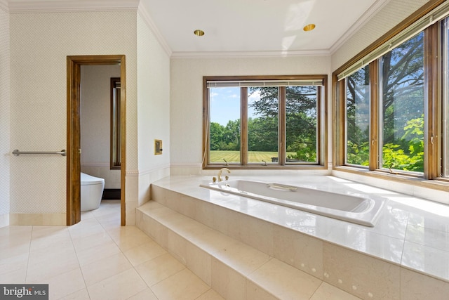 bathroom featuring tiled tub, crown molding, and tile patterned flooring