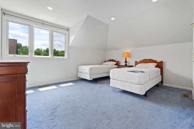 carpeted bedroom featuring vaulted ceiling