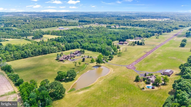 birds eye view of property with a rural view and a water view