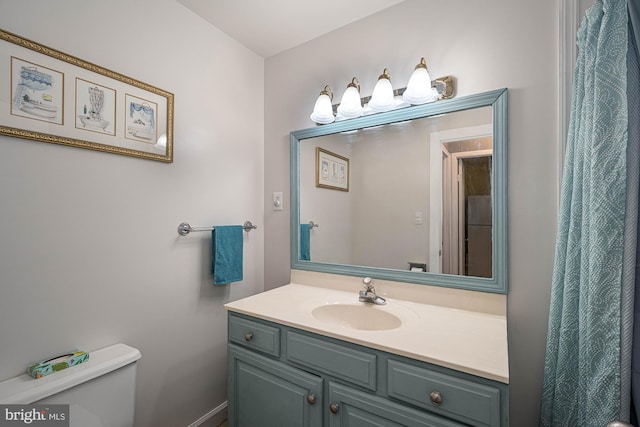 bathroom with vanity and toilet