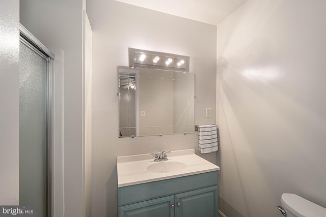 bathroom featuring vanity and toilet