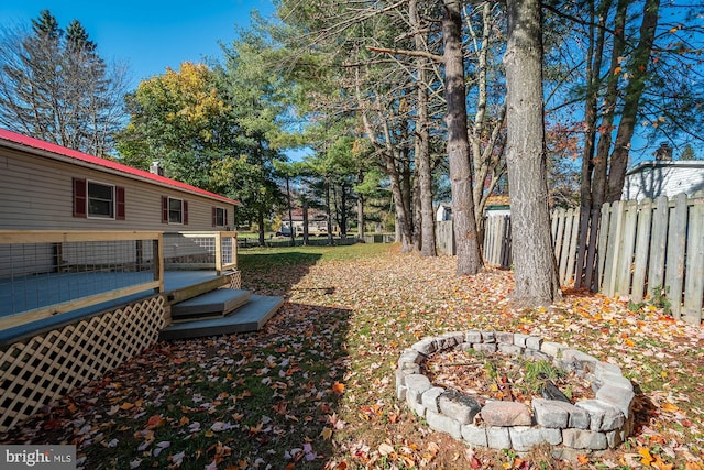 view of yard with a wooden deck