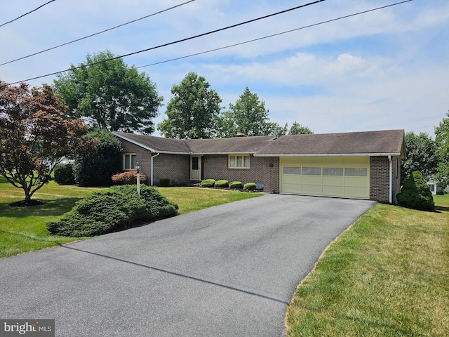 ranch-style house with a front lawn and a garage