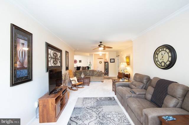 living room with ceiling fan and ornamental molding