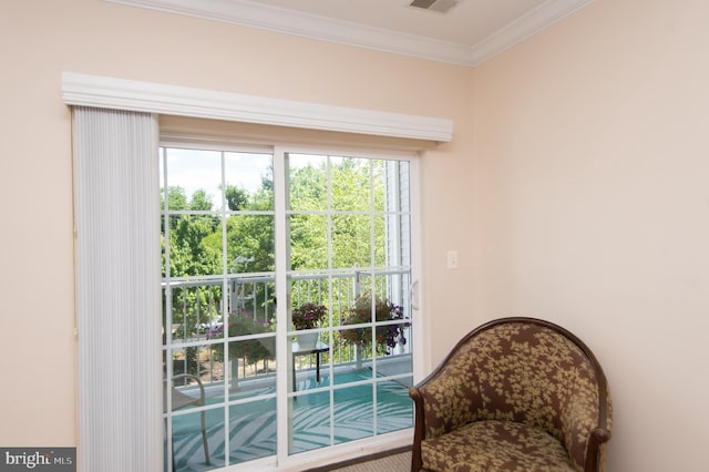 doorway to outside featuring ornamental molding