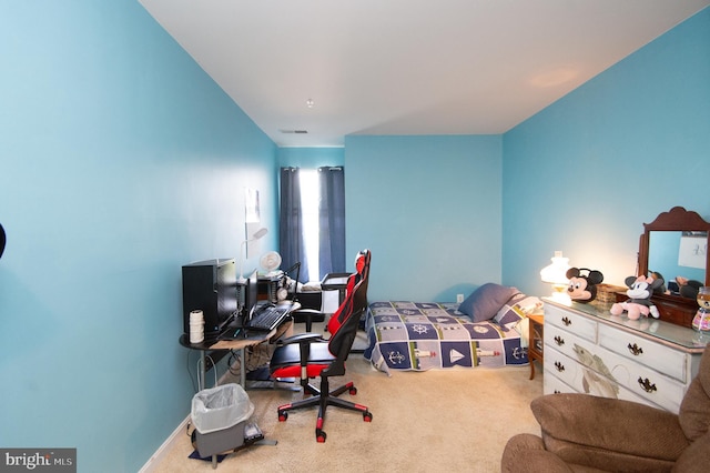 bedroom featuring light carpet