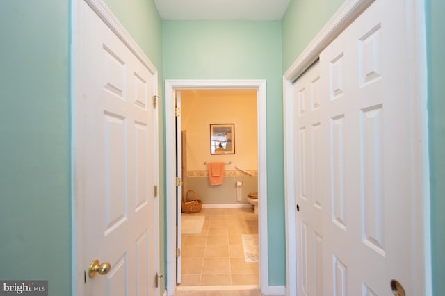 corridor featuring light tile patterned flooring