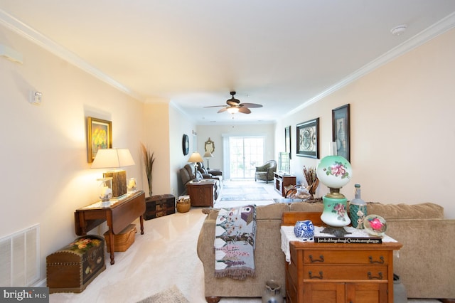 carpeted living room with ceiling fan and ornamental molding