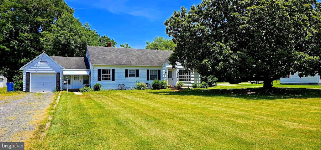 cape cod-style house with a front lawn