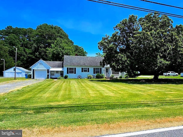 view of front facade featuring a garage and a front lawn