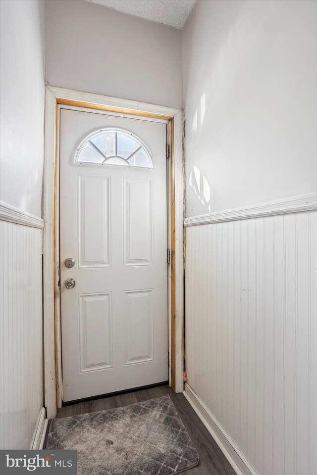 entryway with dark hardwood / wood-style floors