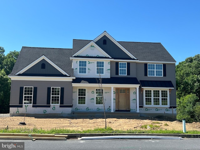 view of front of property with roof with shingles