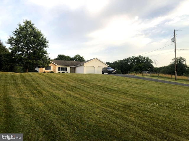 view of yard featuring a garage