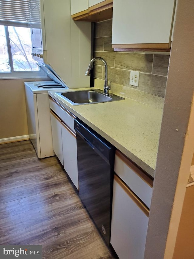 kitchen featuring dishwasher, backsplash, white cabinetry, and sink