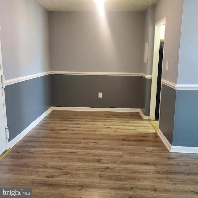 spare room with hardwood / wood-style flooring