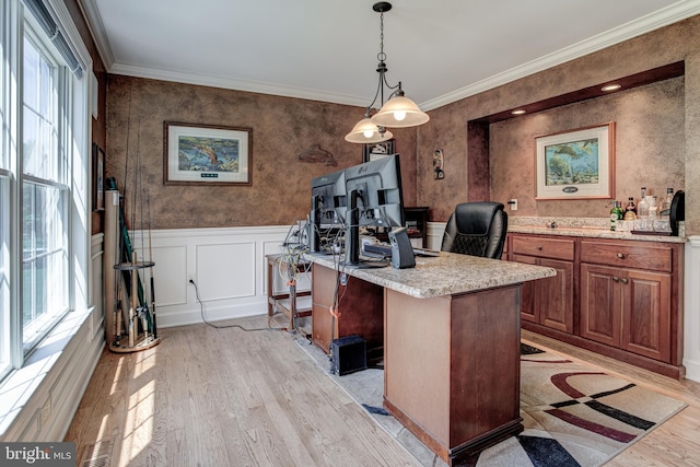 office space with light wood-type flooring and ornamental molding