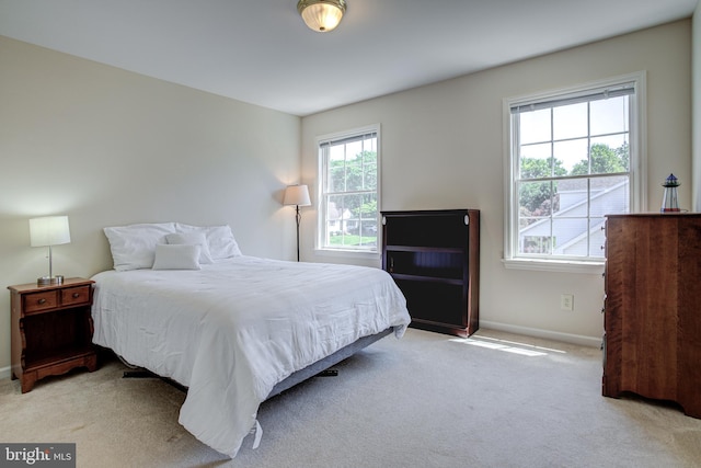 bedroom with light carpet