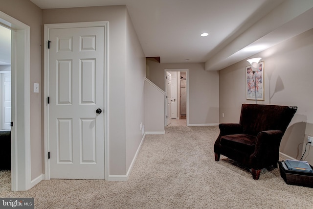 living area featuring light colored carpet