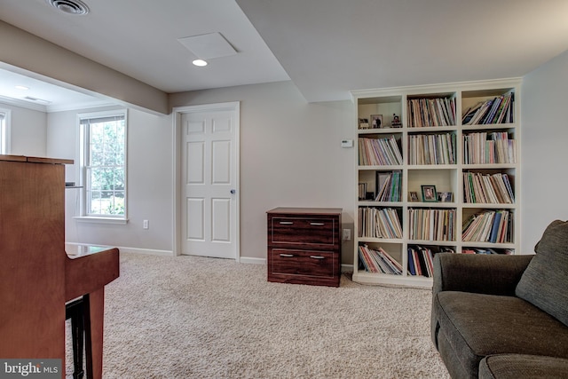 living area with carpet