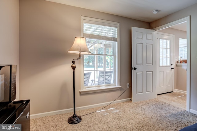 entryway with light carpet