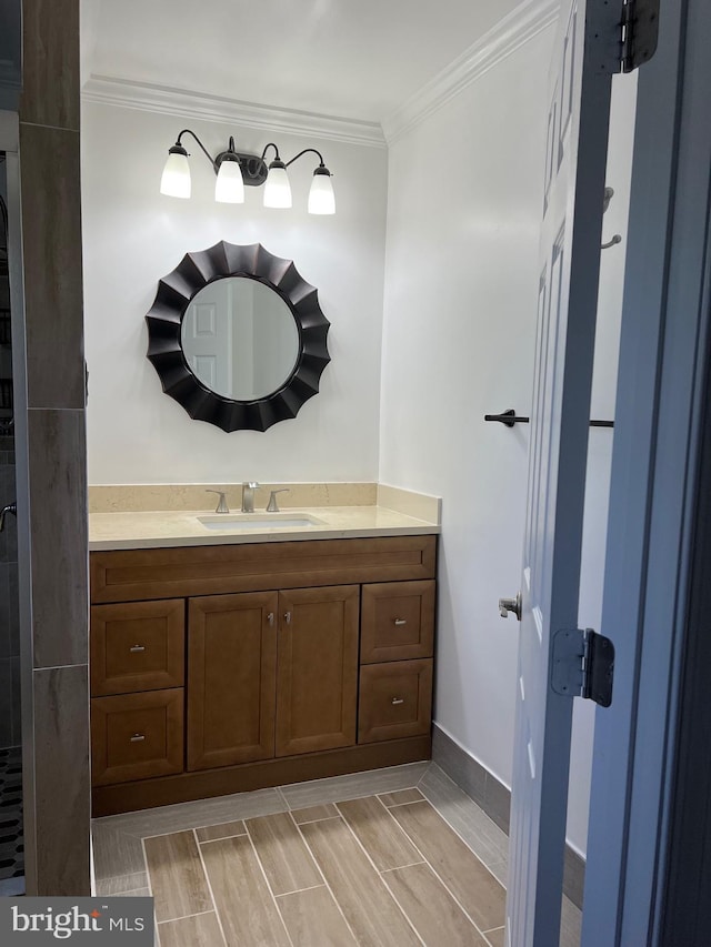 bathroom featuring vanity and crown molding