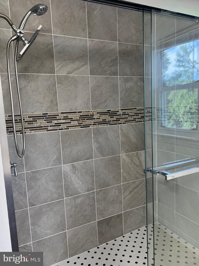 bathroom with a tile shower