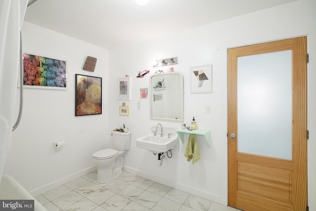 bathroom with sink and toilet