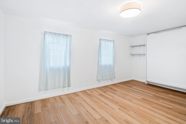 spare room with light wood-type flooring