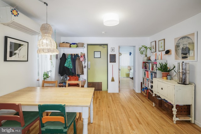 kitchen with light hardwood / wood-style flooring and decorative light fixtures