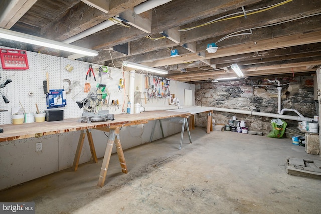 basement with a workshop area