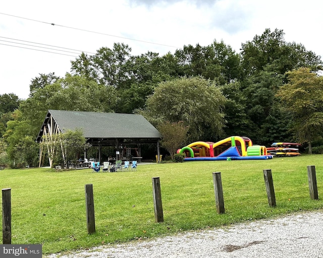 view of property's community with a gazebo and a yard