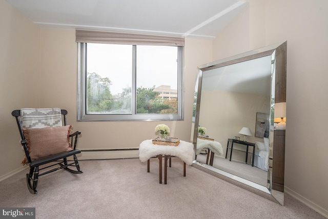 living area with light carpet, vaulted ceiling, and a baseboard heating unit