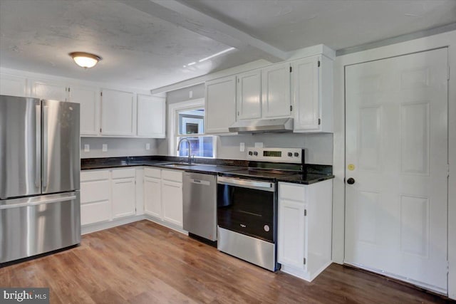 kitchen with white cabinetry, sink, stainless steel appliances, a textured ceiling, and light wood-type flooring