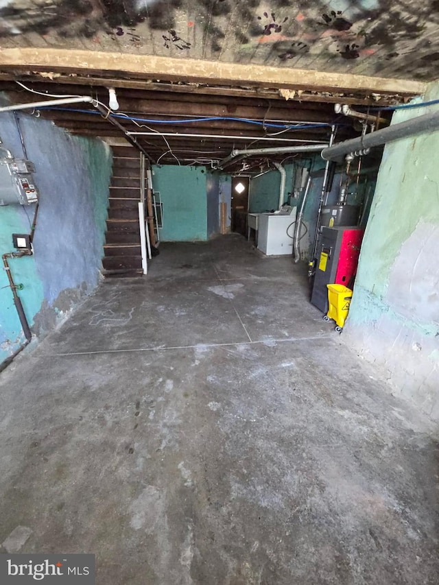 basement featuring washer / clothes dryer and heating unit