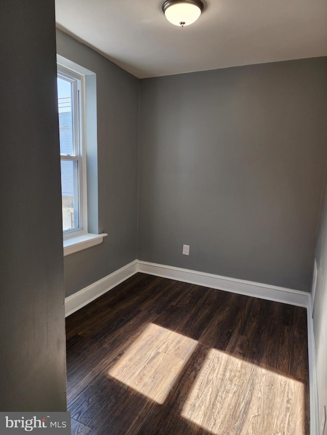 empty room featuring dark hardwood / wood-style floors