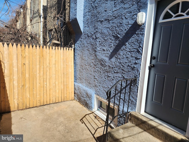 doorway to property with a patio area